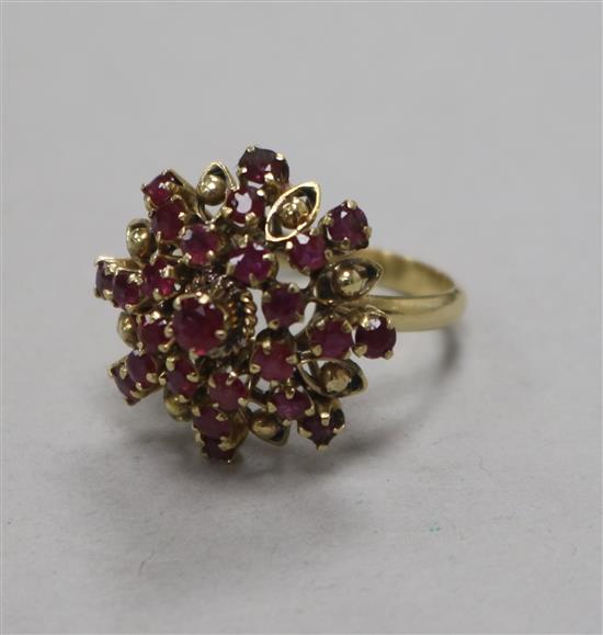 A 14ct ruby and diamond cluster dress ring, size N.